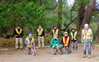 Group of socially-distanced people with pruning tools
