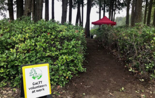 "GaLTT volunteers at work" sign at beginning of pathway cleared to width suitable for accessibility requirements.
